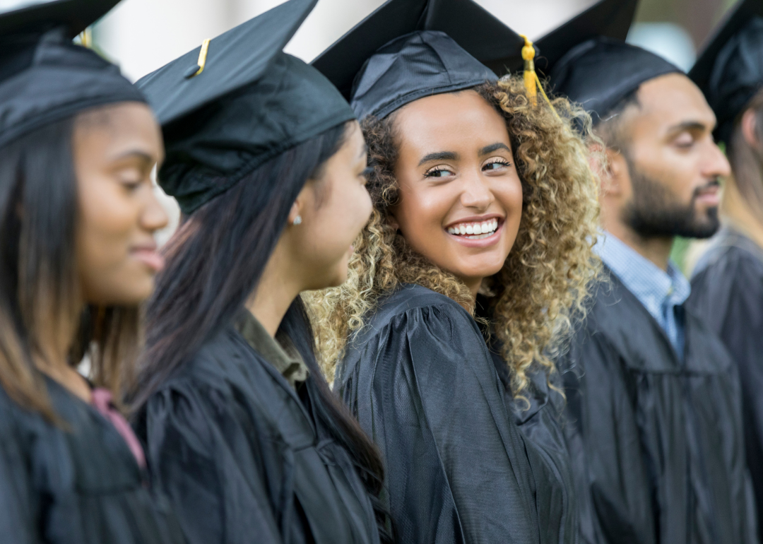 Female college graduates in line to receive their diplomas