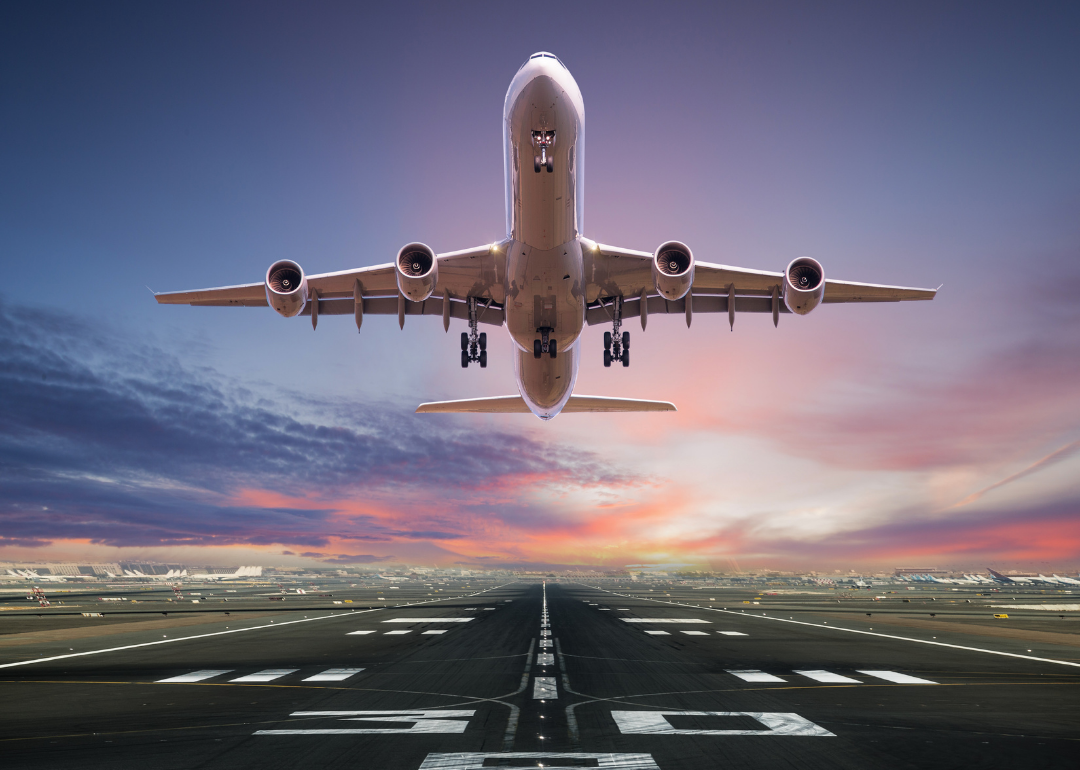 A front view of an airplane taking off