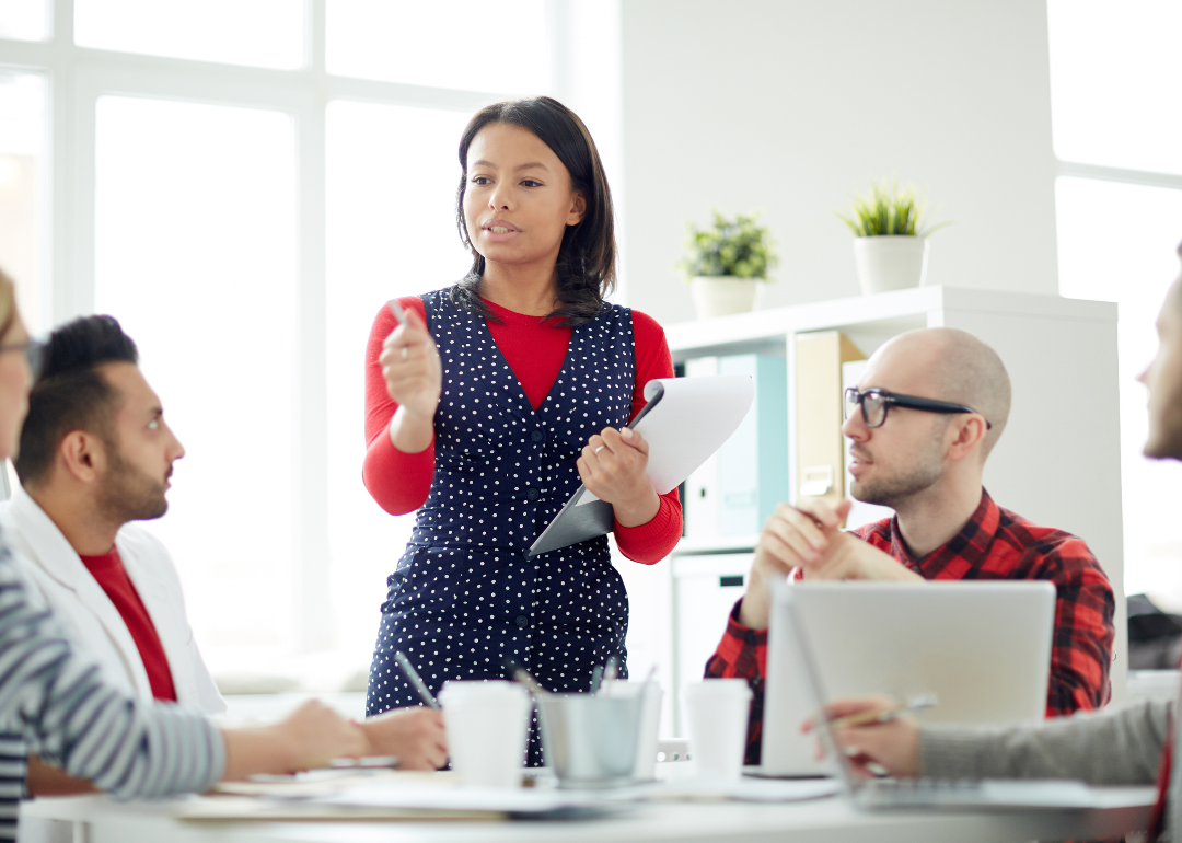 A manager leads a team meeting