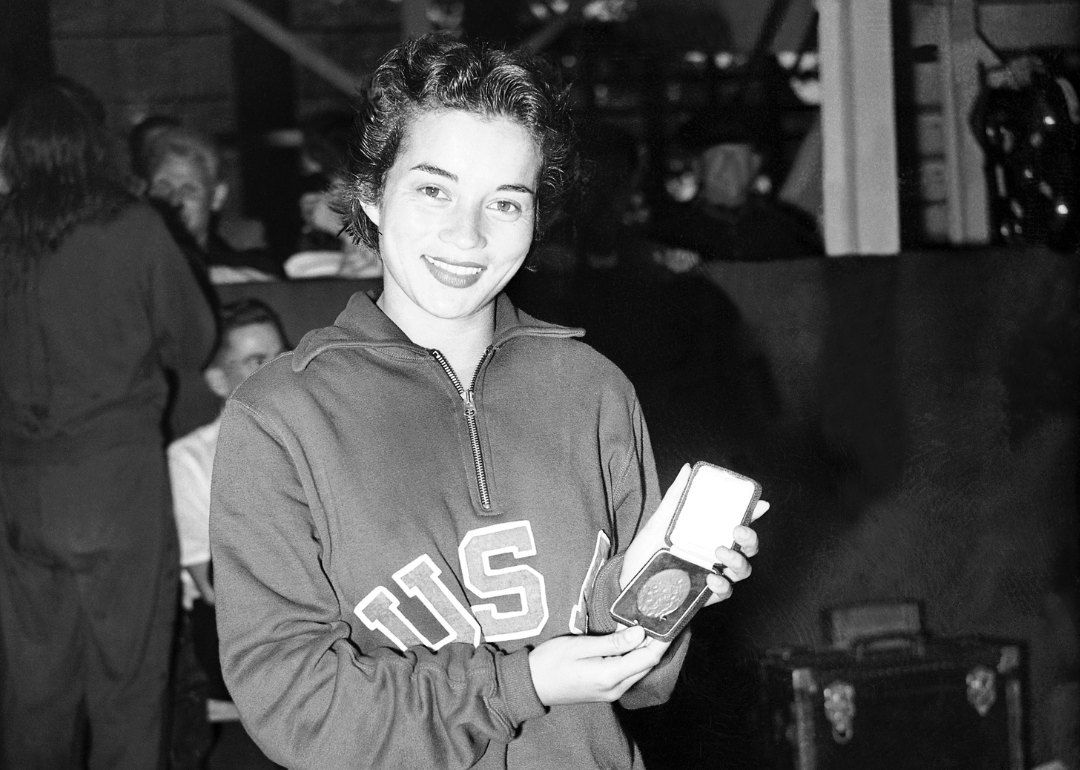 Vicky Draves shows off her gold medal at the 1948 Olympic games in London.