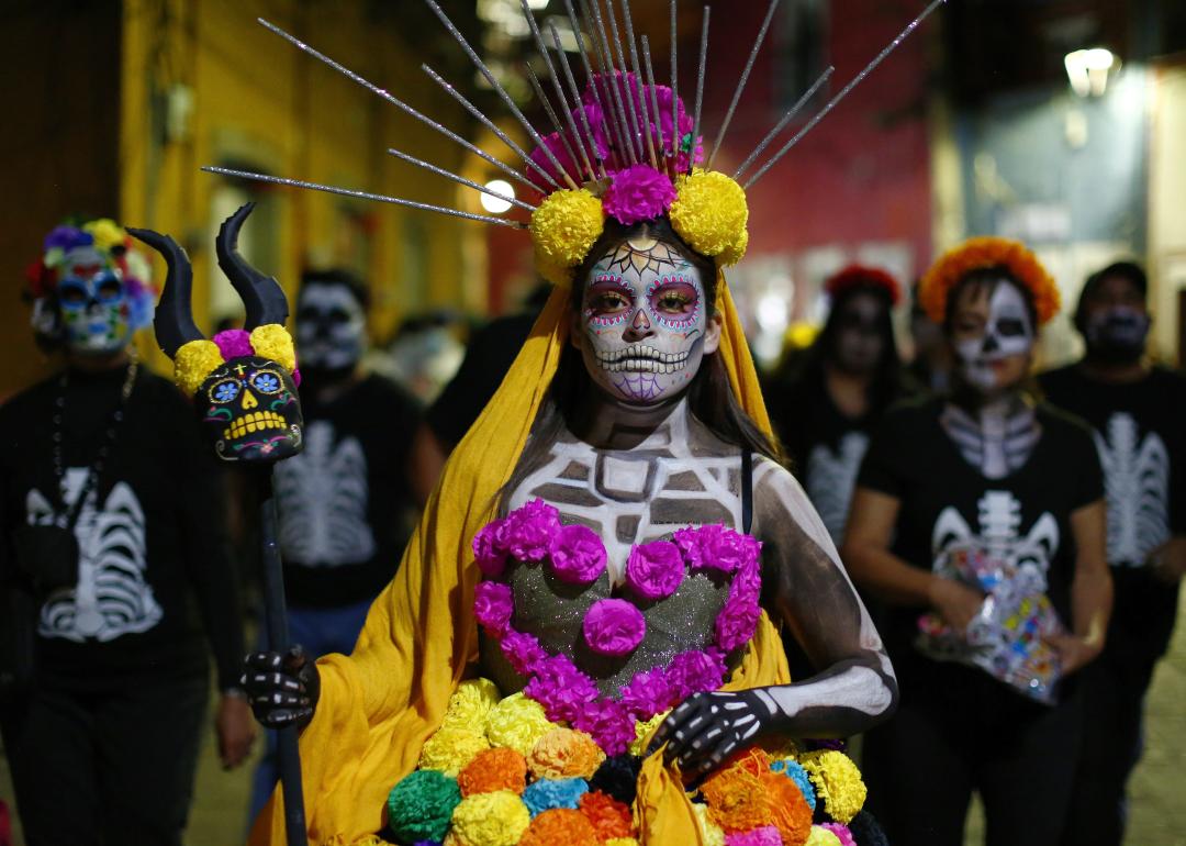 A woman dressed as a catrina during the parade of the "Day Of The Dead Festival" in Guanajuato.