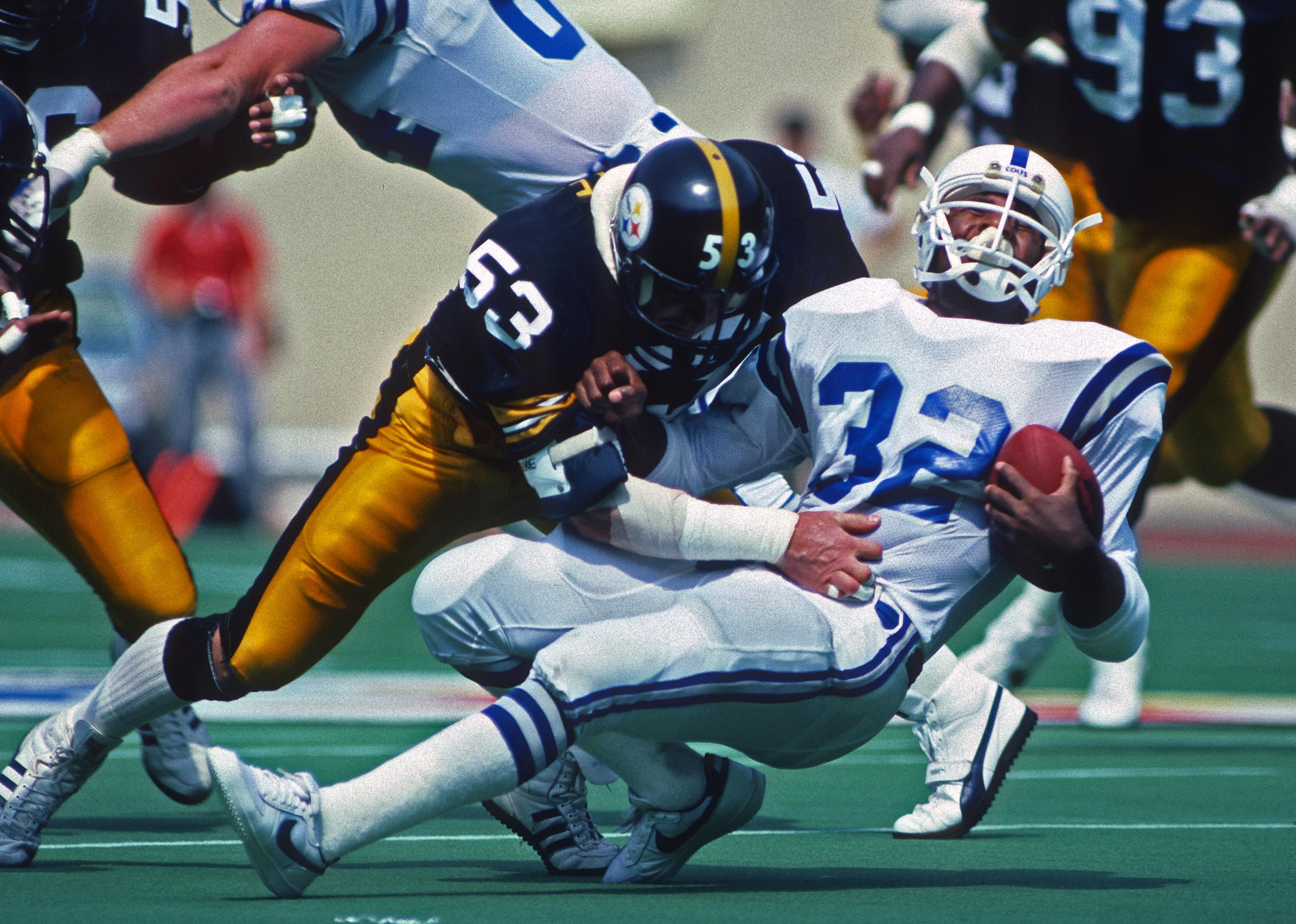 Linebacker Bryan Hinkle of the Pittsburgh Steelers tackles running back Randy McMillan of the Indianapolis Colts.