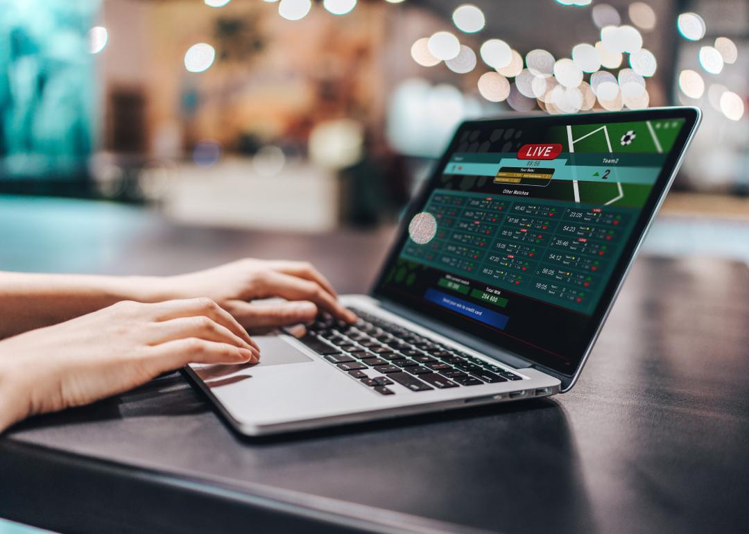 A person making bets online on sport bookmaker's website.