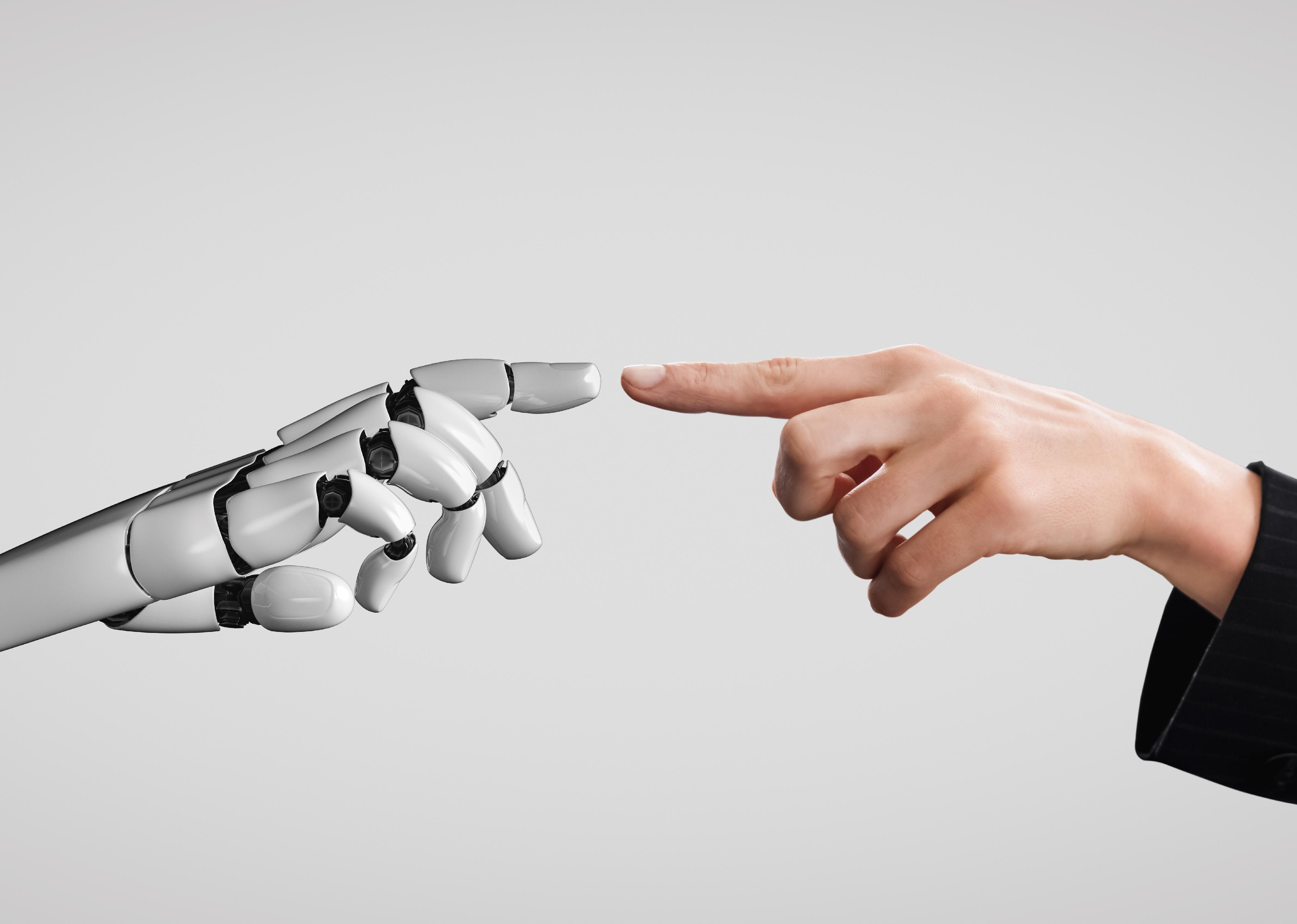 Human and robot fingers touching. 