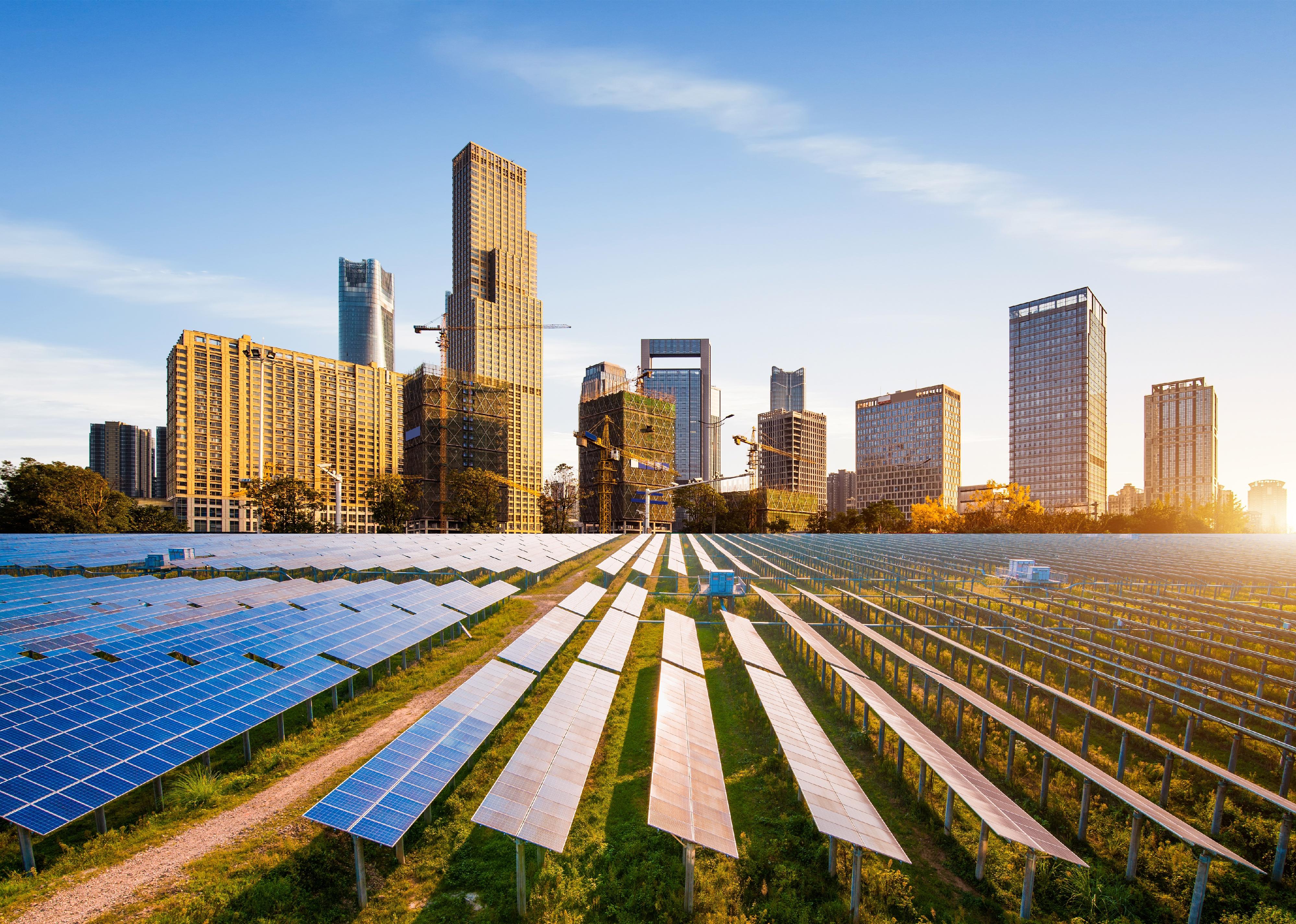 Solar power plant with skyline in background