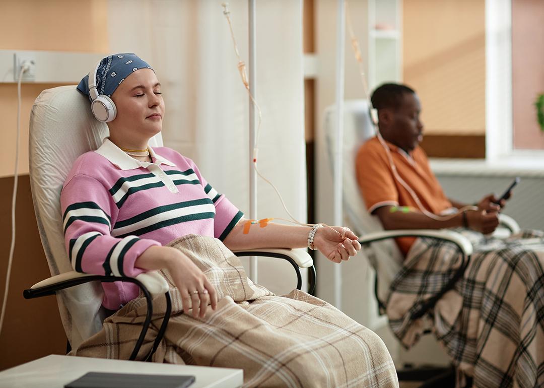 Chemotherapy patients listening to music during a treatment session.