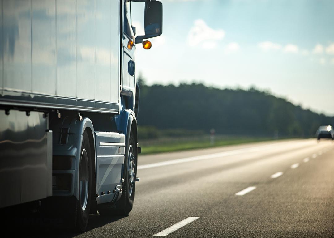 Long moving truck on a highway.
