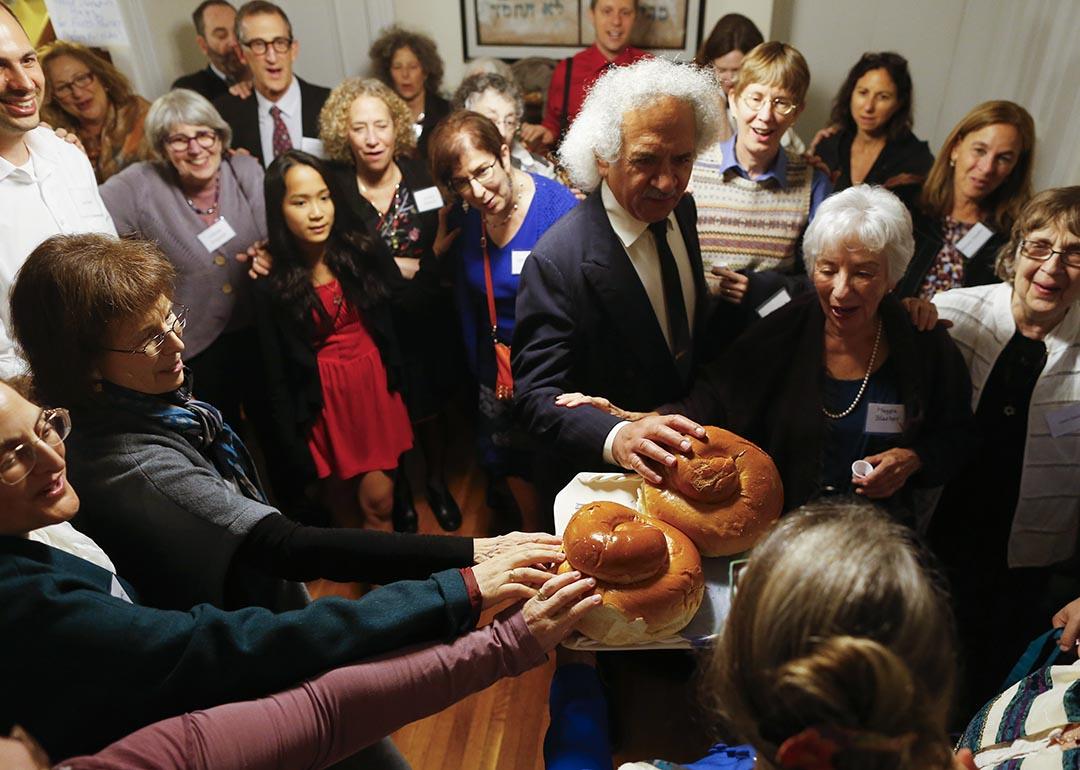 Congregation Eitz Chayim join together for the kiddush during their observance of Rosh Hashana in Cambridge, Massachusetts September 24, 2014.