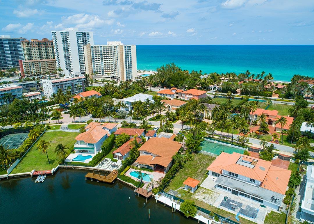 Aerial shot of luxury Miami homes with ocean in background.