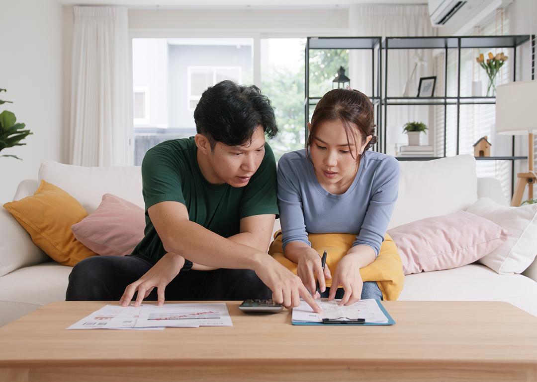 A young couple organizing expenses.