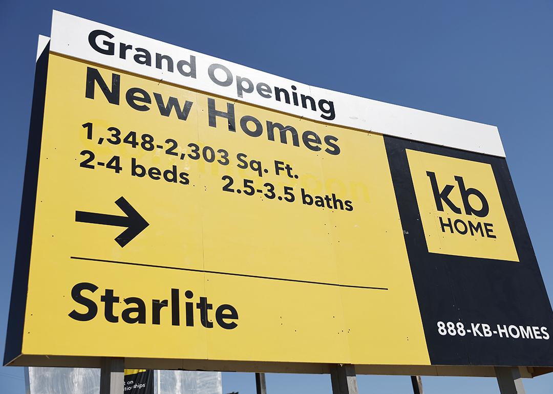 A "Grand Opening" of new homes signage is displayed at a new KB Home community in South El Monte, California.