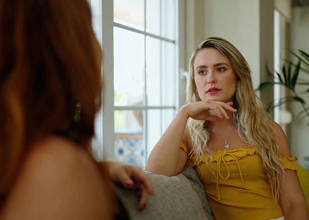 A woman talking to her friend at home.