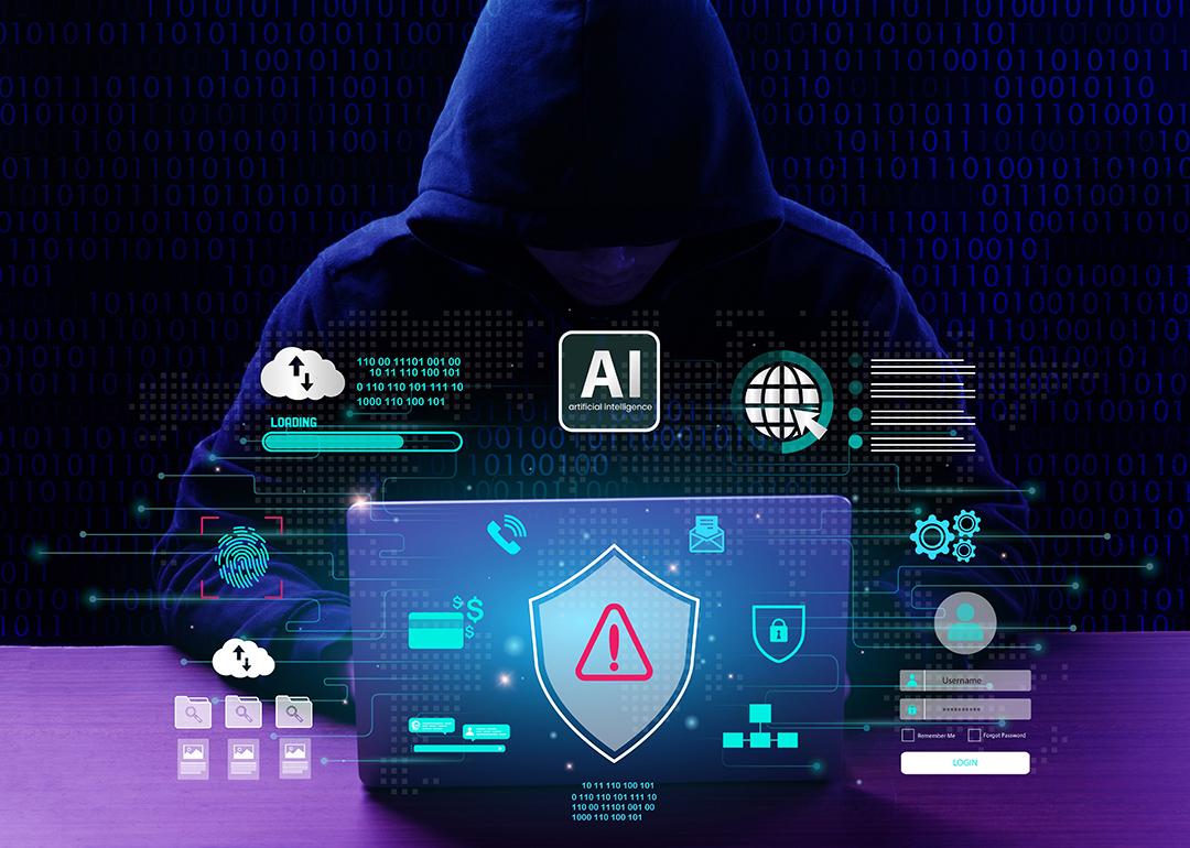 Anonymous person in a hoodie using a laptop illustrated with cyber security and AI technology warning graphics.