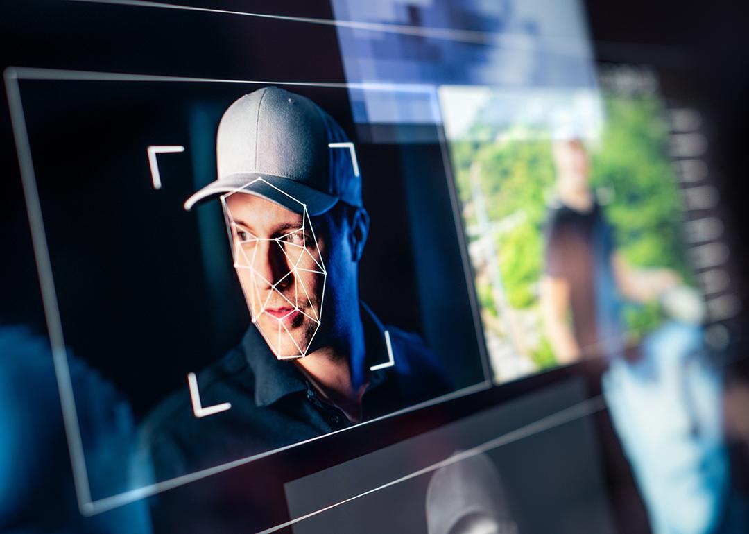 Picture of man's face on a computer screen.