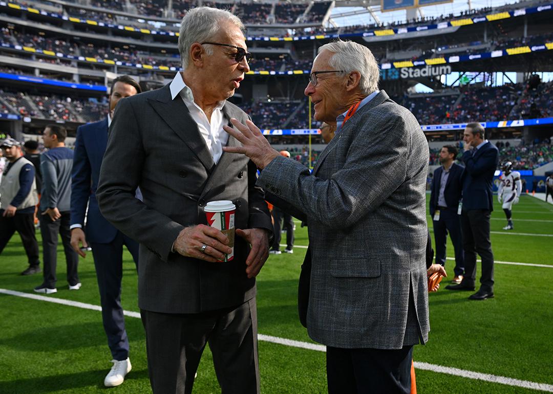 Stan Kroenke, owner of the Los Angeles Rams, talks with Rob Walton, owner of the Denver Broncos before a game at SoFi Stadium in Inglewood, California.
