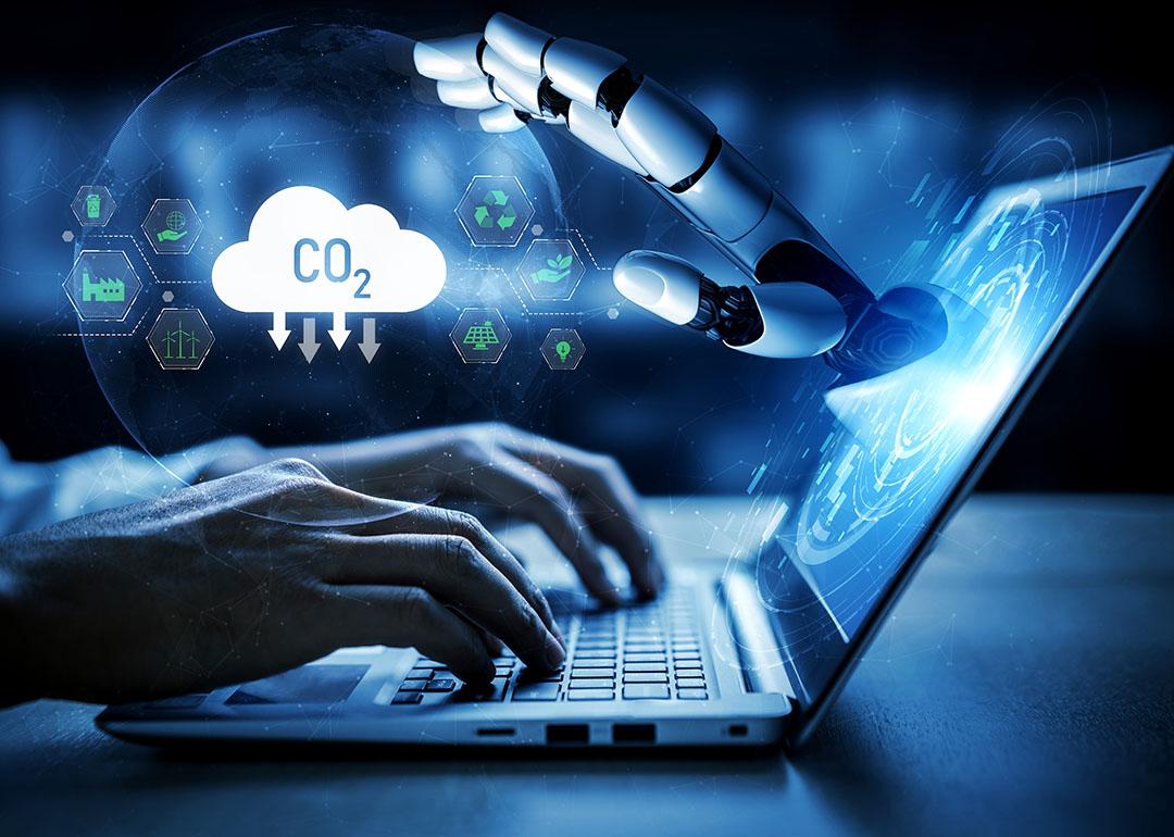 An illustration depicting someone working on computer and using energy resources with AI, with icons symbolizing carbon footprint superimposed. 