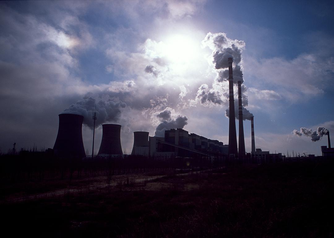 Silhouette of a coal-fired power plant spewing smoke into the air in Daqi, Inner Mongolia Autonomous Region, China.