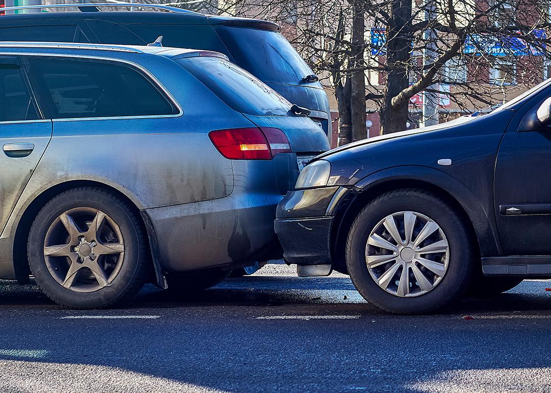 Two cars crashed on a street.