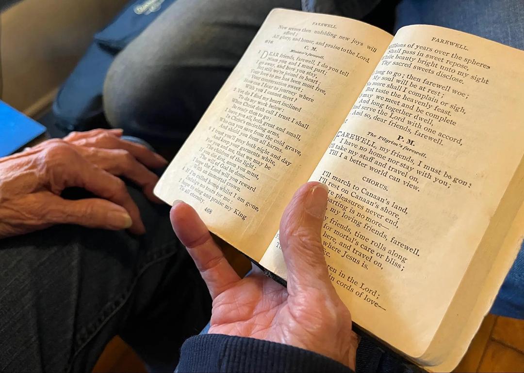 'Amazing Grace' as it appears in Ginny Hawker's family heirloom songbook, Lloyd’s Primitive Baptist Hymns. You can see stains in the margins, left by the tobacco-covered hands of her aunt Annie Maud Puckett. 