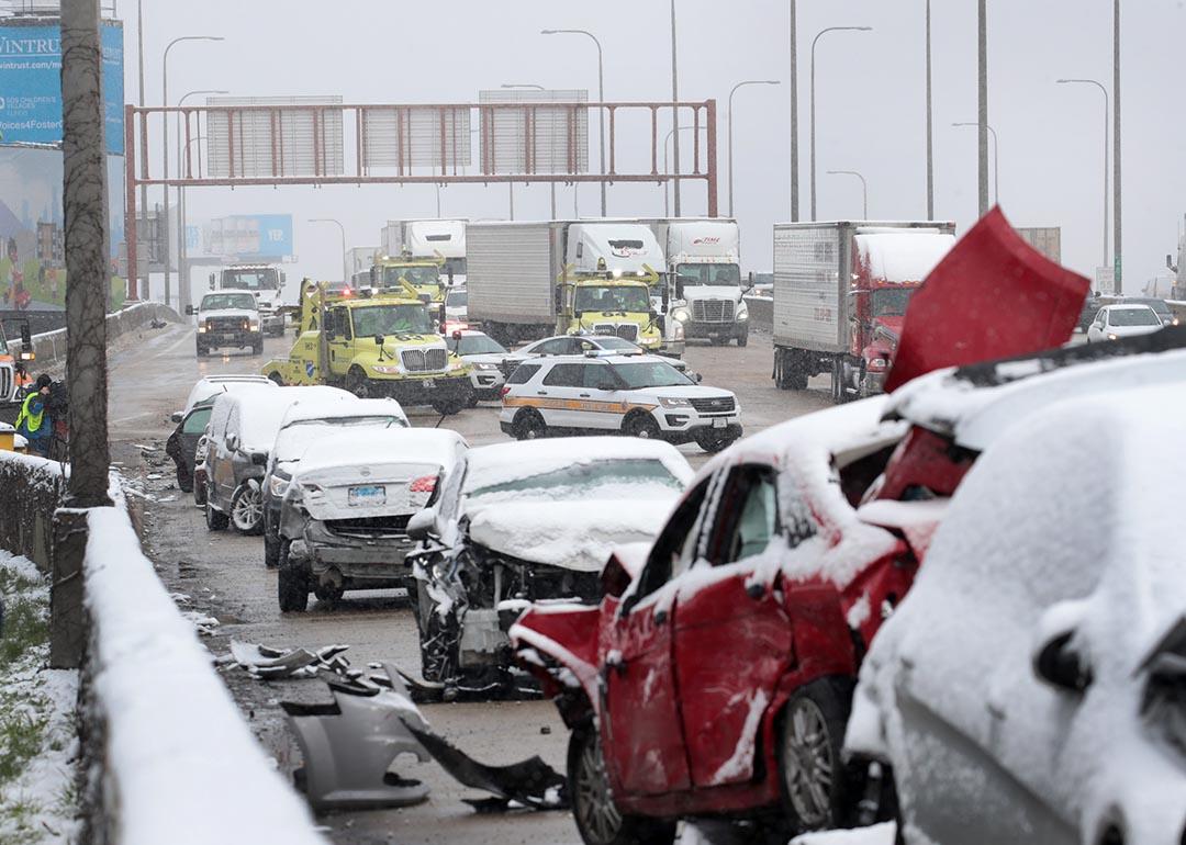 State police supervise the cleanup of a 54-car pileup in the snow on the Kennedy Expressway near downtown on April 15, 2020 in Chicago, Illinois.