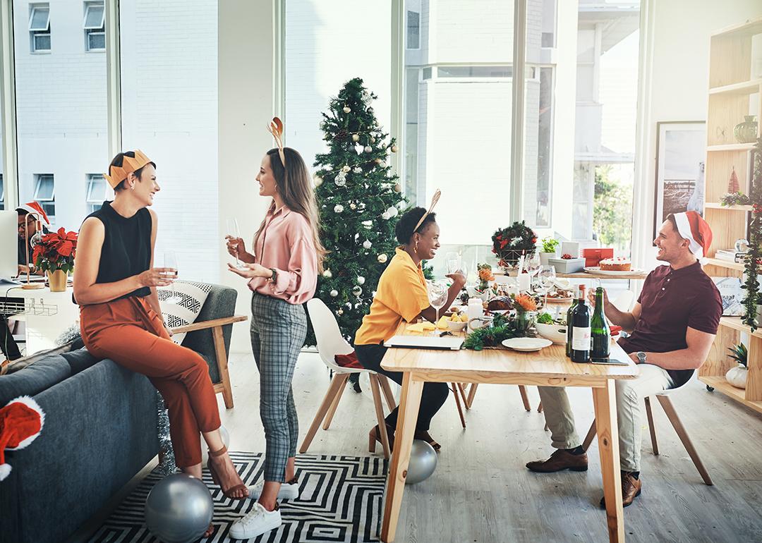 Coworkers having a Christmas party in their office.