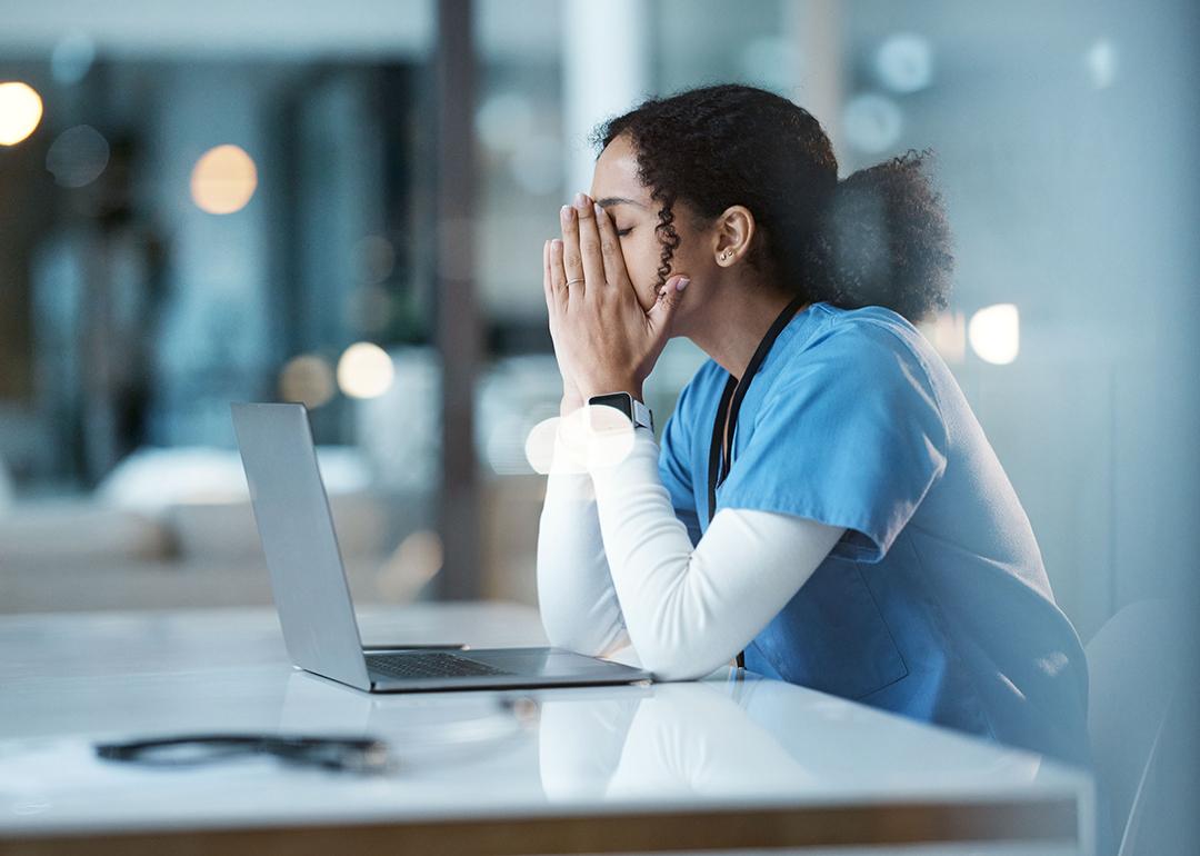 A hospital nurse experiencing burnout at work.