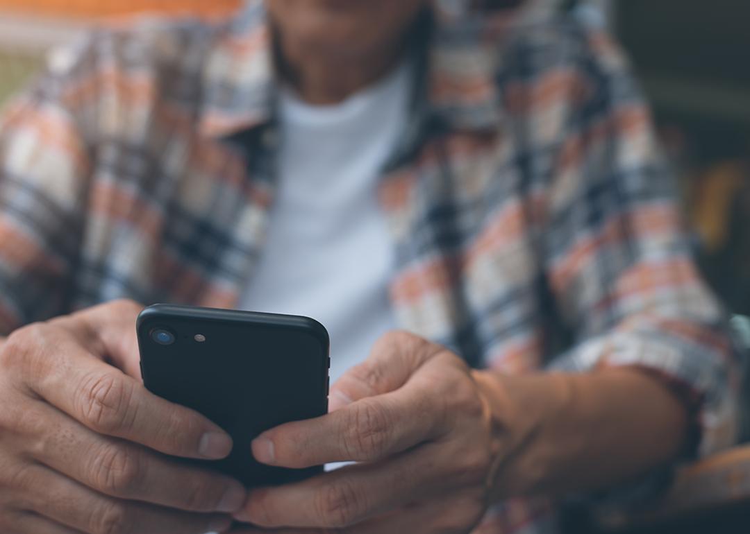 A man using a smartphone.