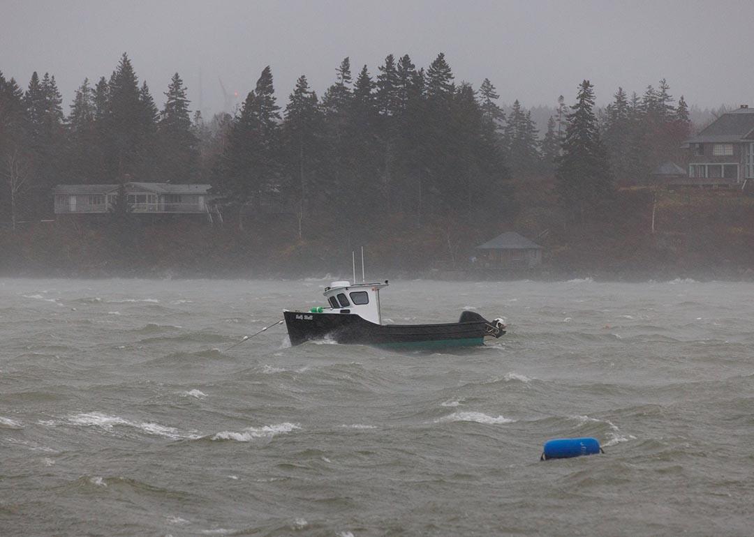 A lobster boat at sea during a storm in the North Haven Harbor, Maine.