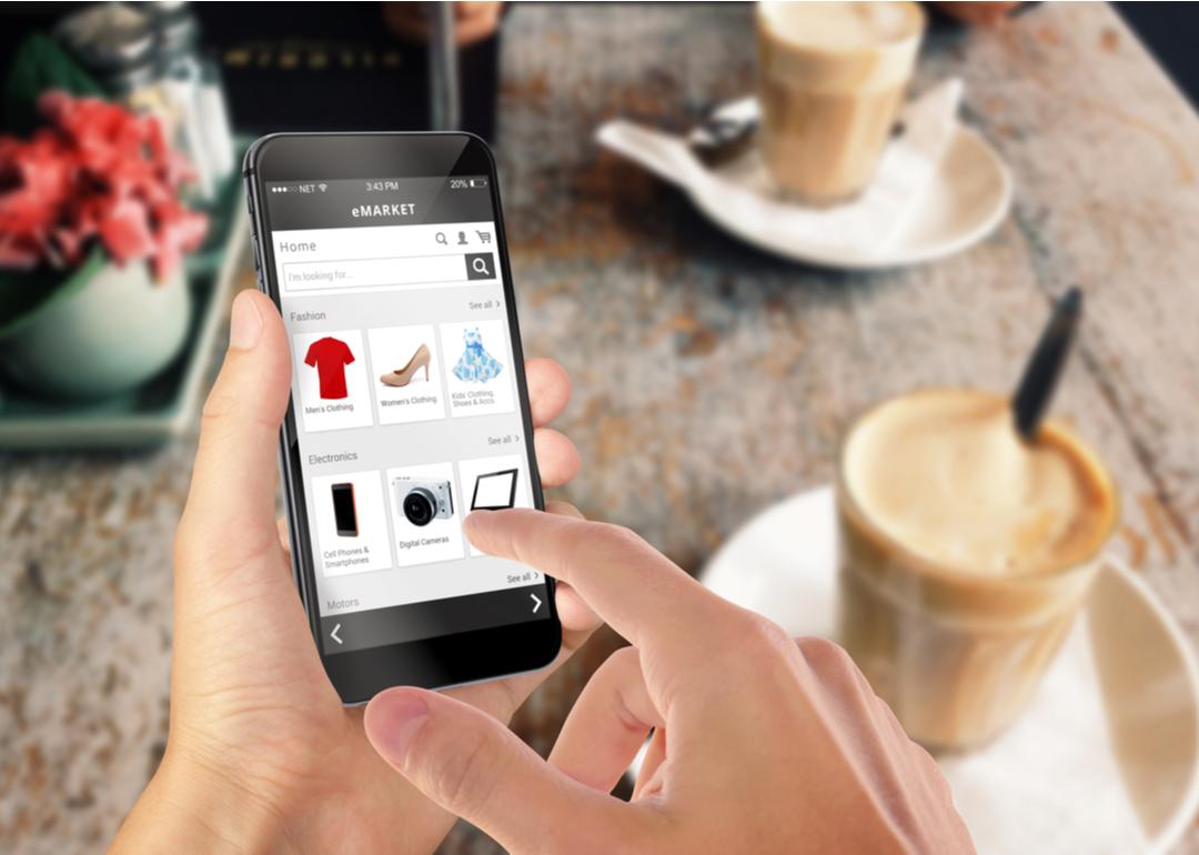 A man browsing digital advertisements on his phone