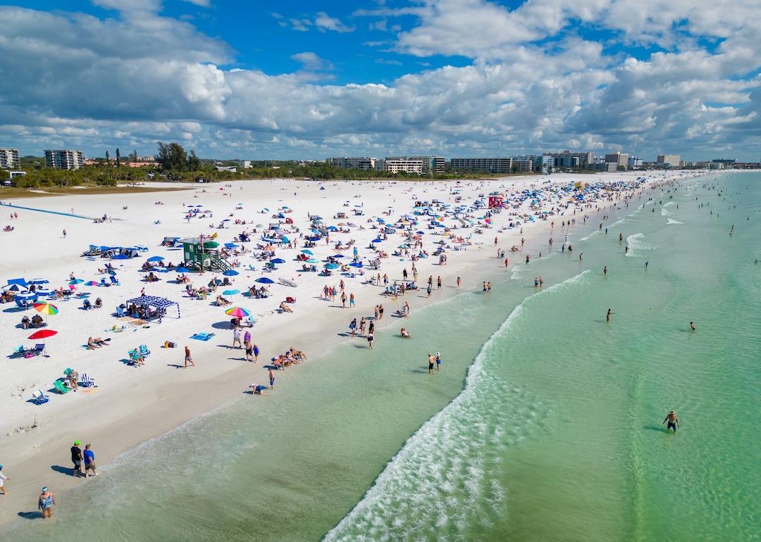 Aerial photo of tourists on Siesta Key Beach in Florida.