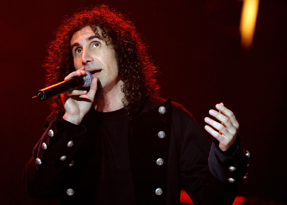 Serj Tankian speaks with microphone.
