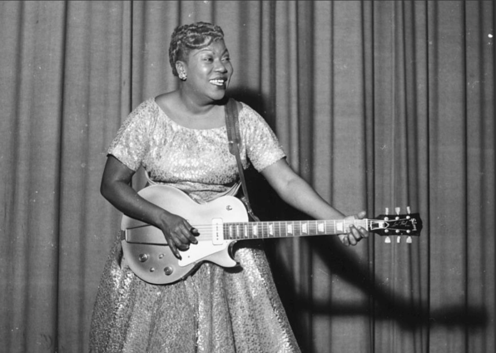 Sister Rosetta Tharpe performing with guitar.