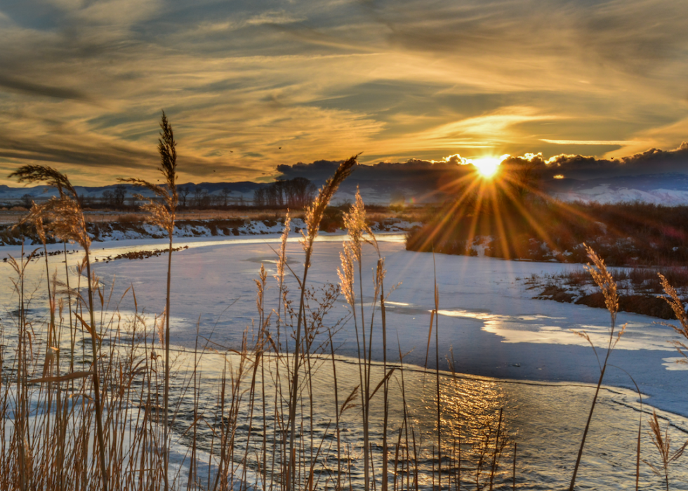 A sunset over a frozen lake.
