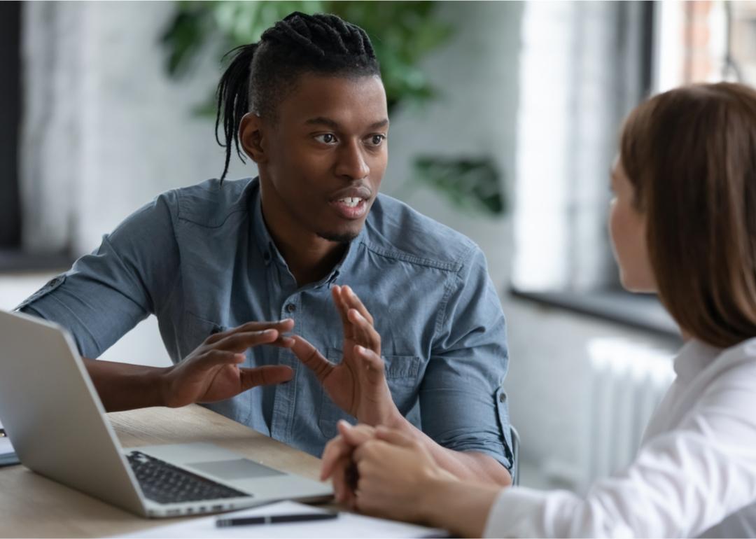Team member having discussion with coworker.