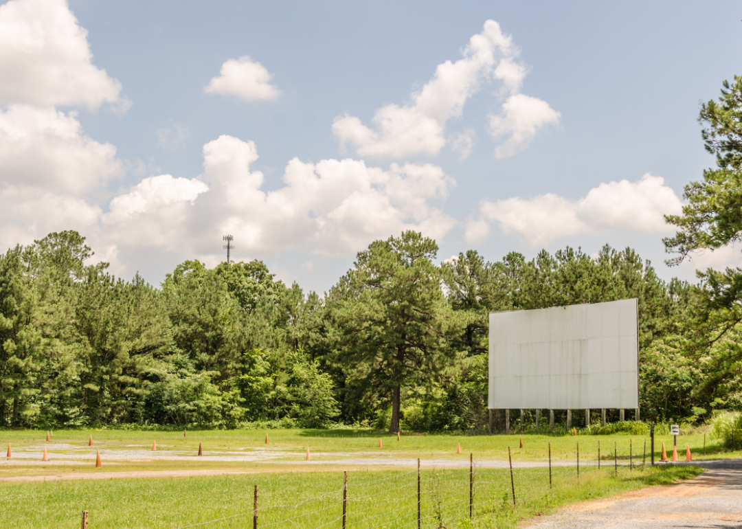 Drive-in movie screen on summer day.