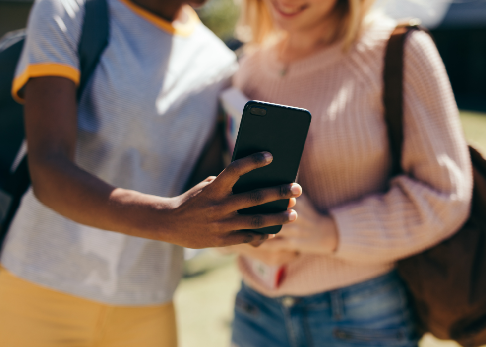 Two students looking at cellphone