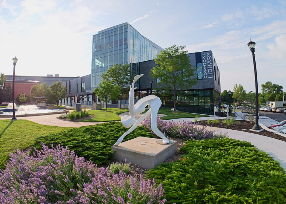 Gardens and sculpture in front of the Olathe Public Library.