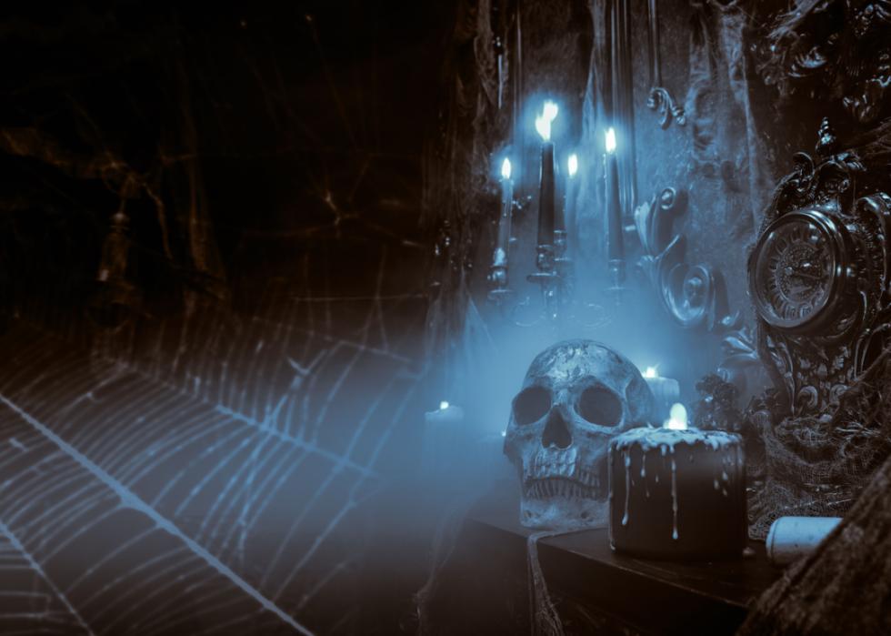 Spooky cobwebs, candles, and skull.
