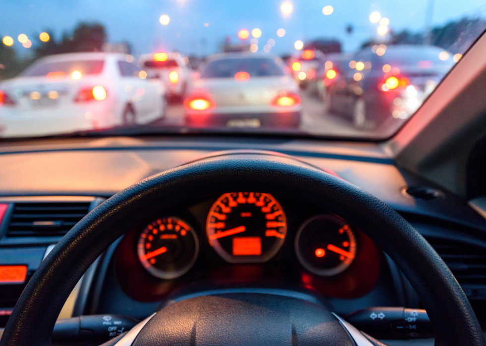 Car console waiting in traffic at twilight