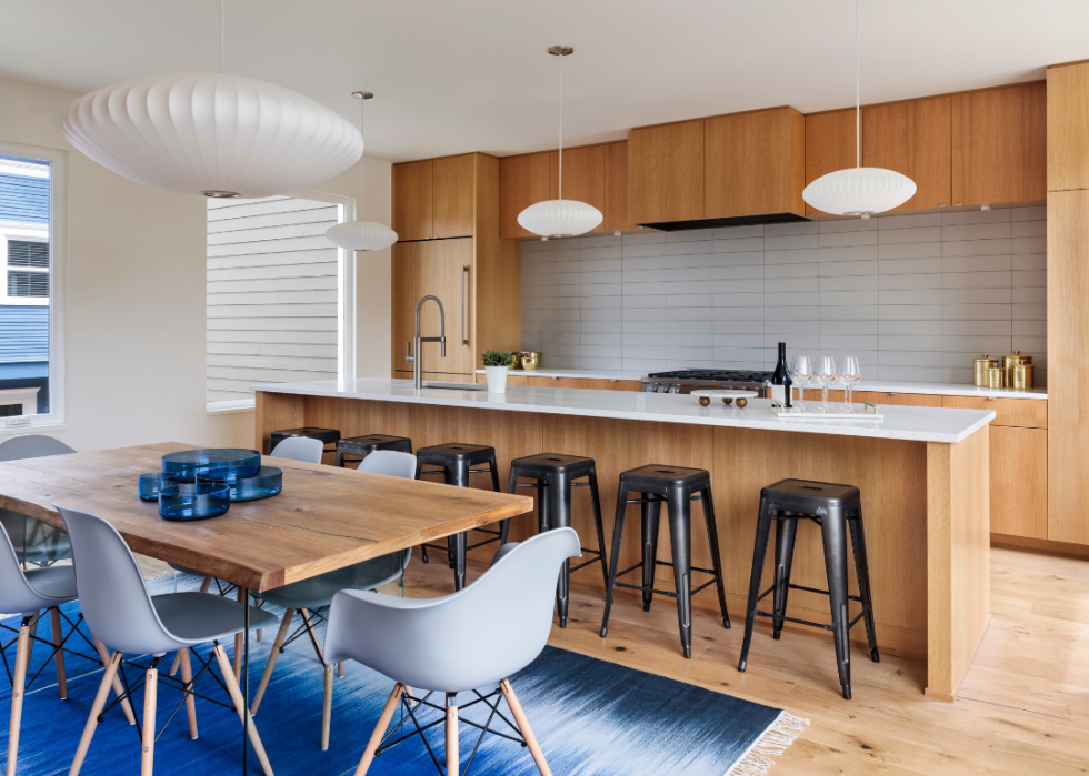 Midcentury modern kitchen with Nelson bubble lamps and Eames chairs.