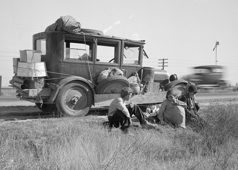 Depression refugee family from Tulsa with car.