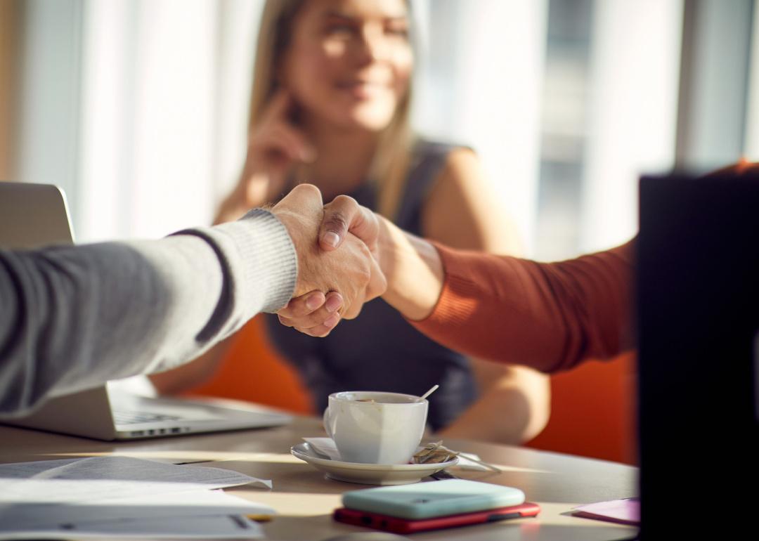 People shaking hands in a relaxed atmosphere.