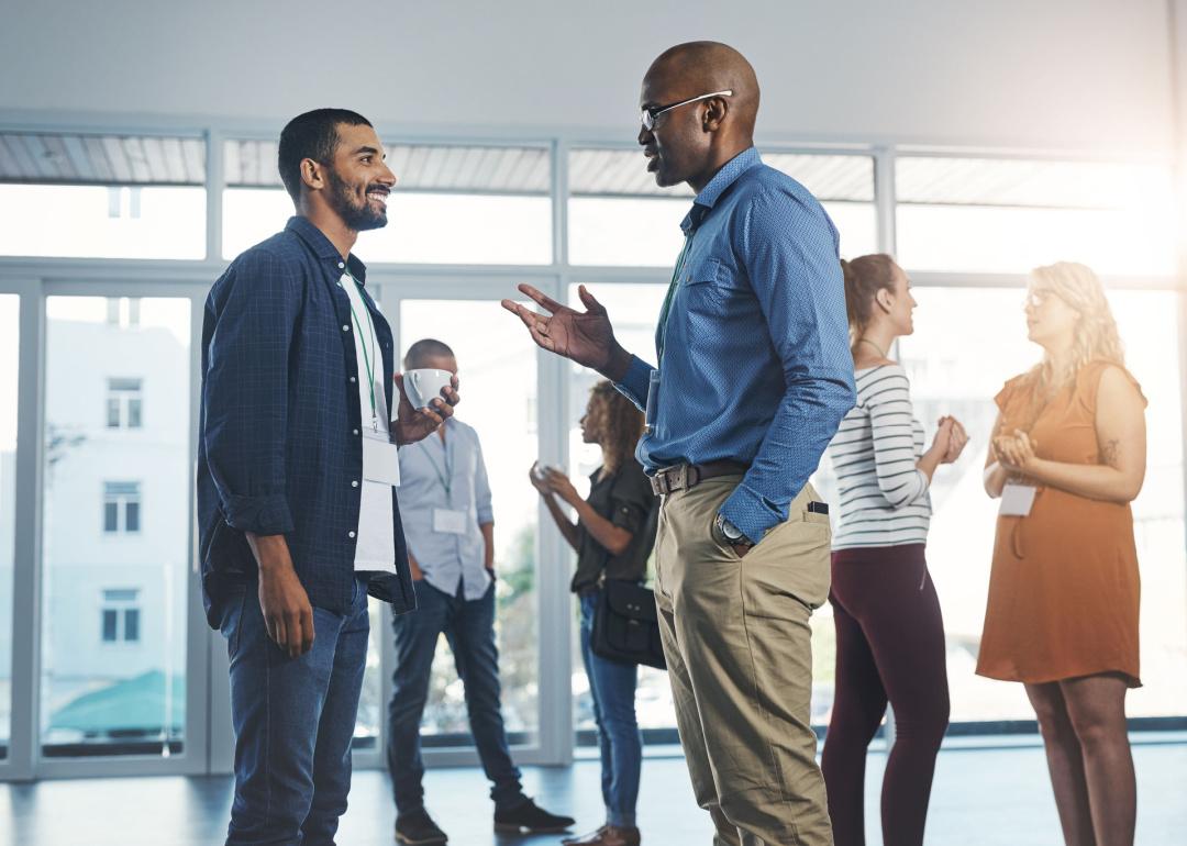 Professionals talking at a networking event.