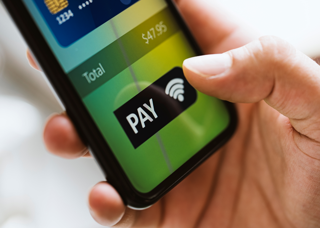 Person using mobile payment app.