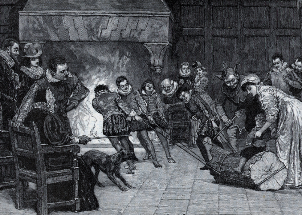 An engraving by H.M. Paget titled Hauling in the yule log.