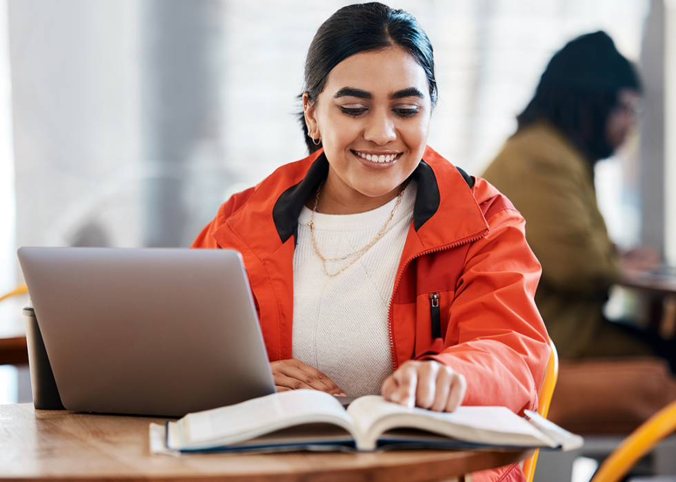 Student working on research project in library.