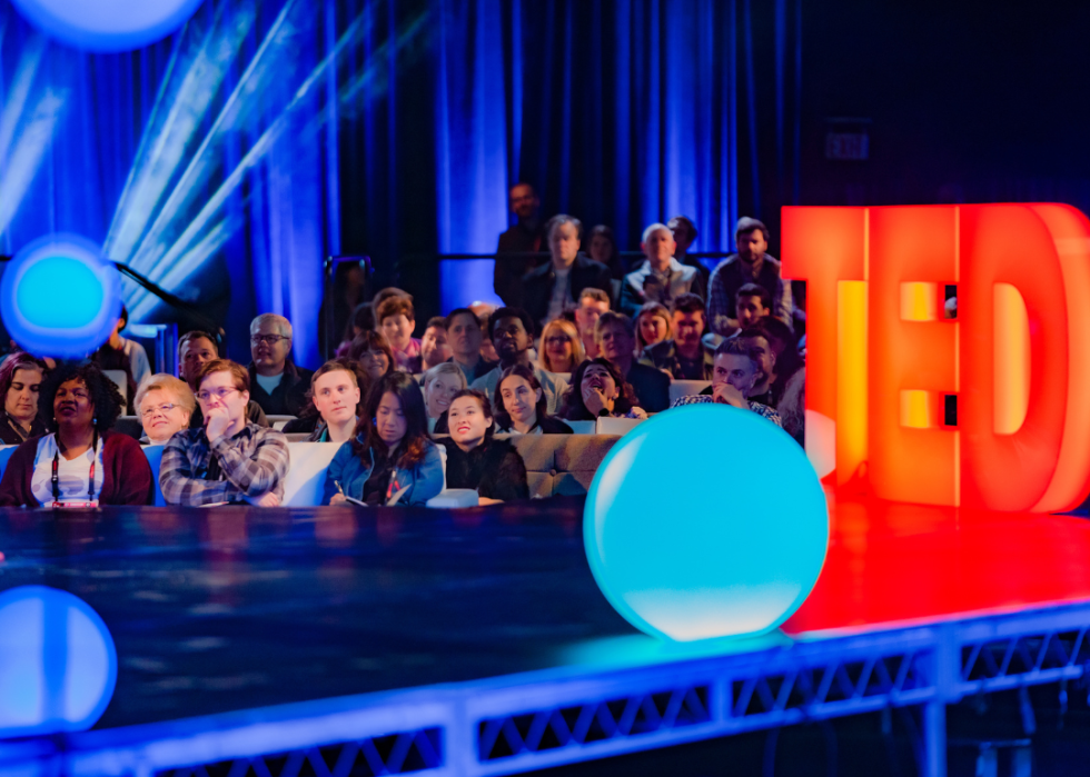 Attendees watch a live TED Talk