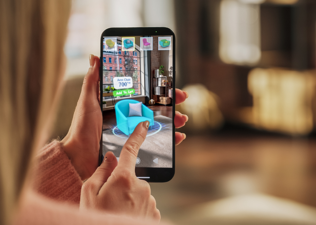 Woman using app to select furnishings.