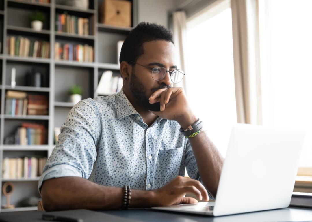 Person reading information on laptop.