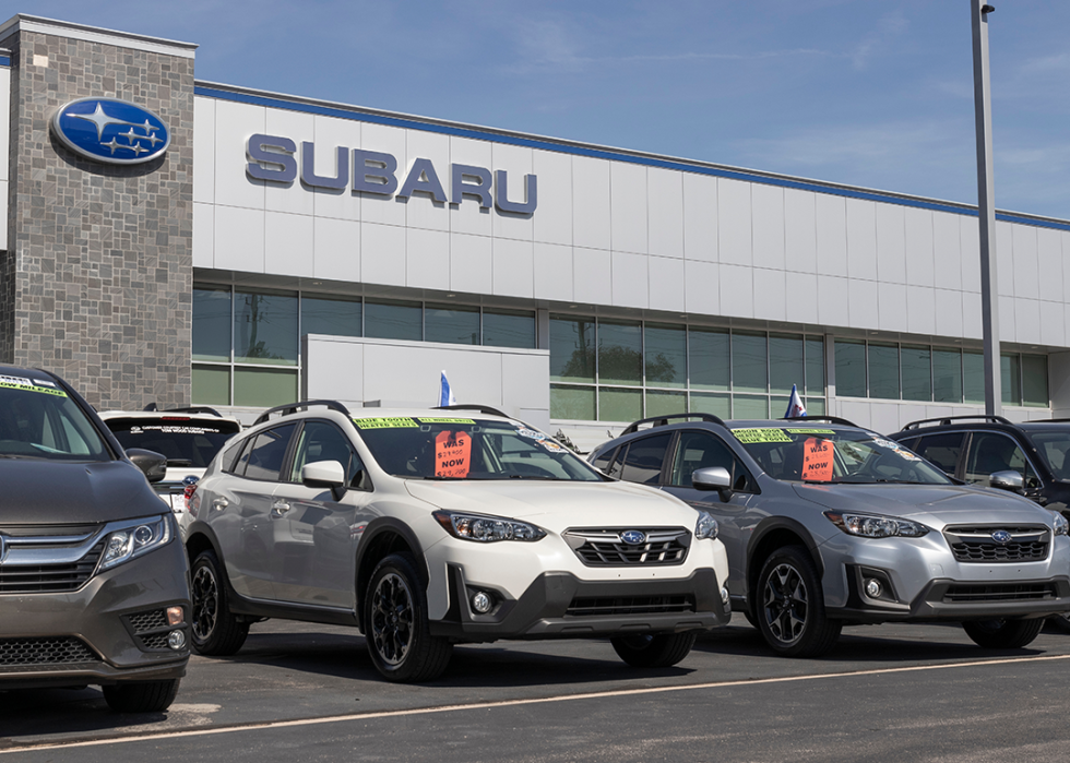 Used car display at a Subaru car dealership.